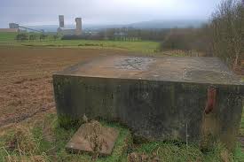 Concrete water tank in a field